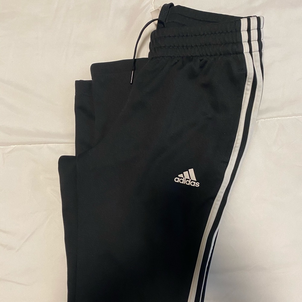 Adidas track pants.